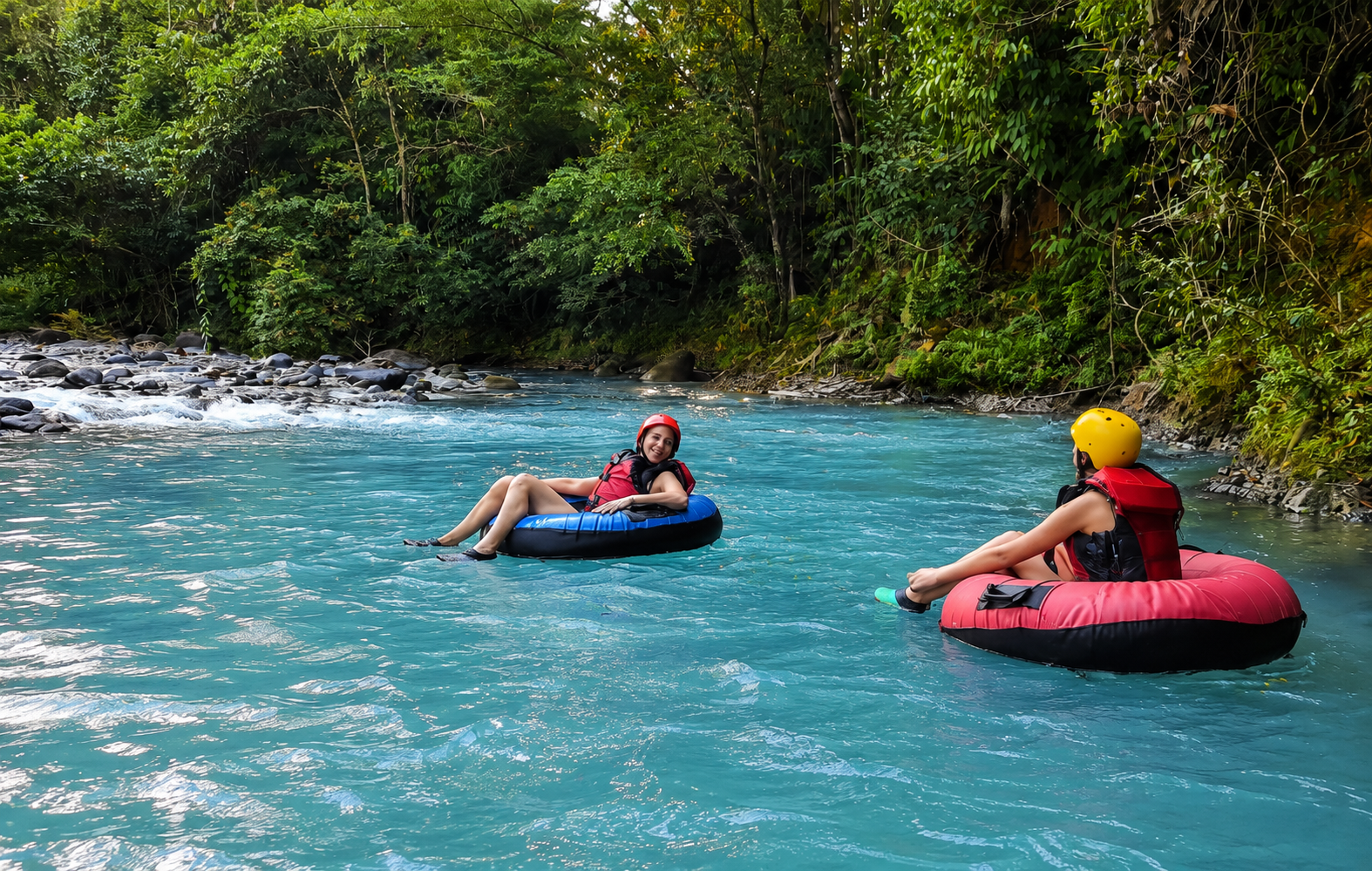 Tubing on the bright blue Río Celeste